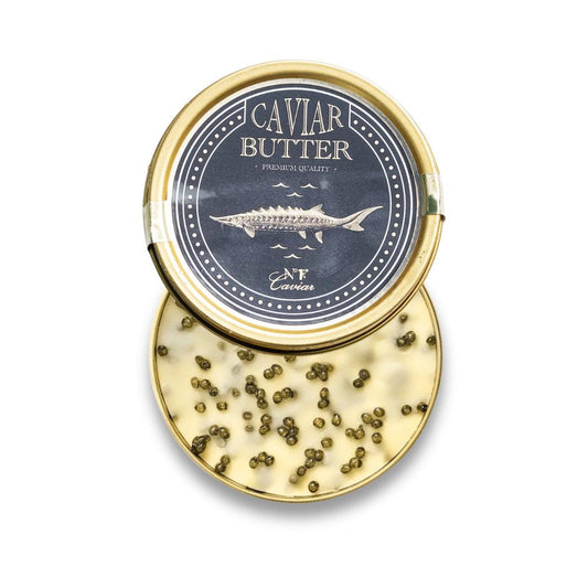 Caviar butter container with gold lid and visible caviar on a white background