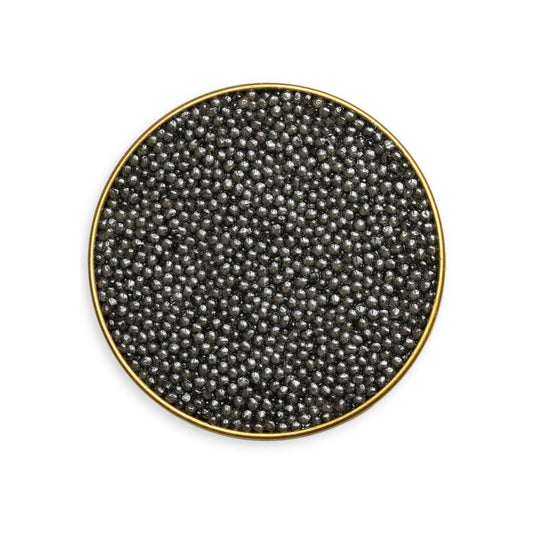 Round black caviar dish with gold rim on a white background