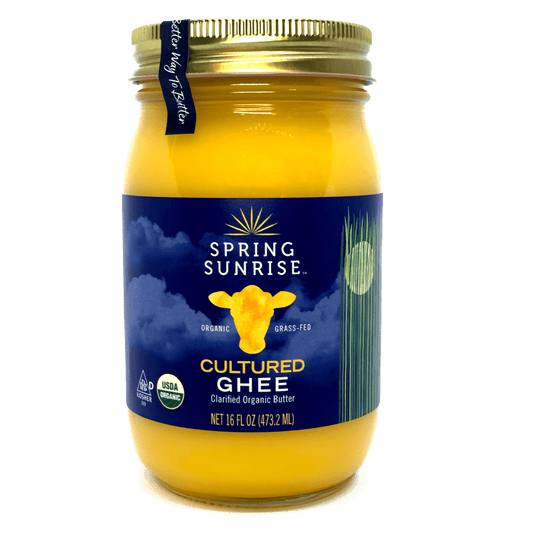 Jar of Spring Sunrise Cultured Ghee with a blue label on a white background