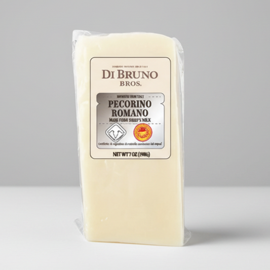 Block of Di Bruno Bros. Pecorino Romano cheese on a gray background